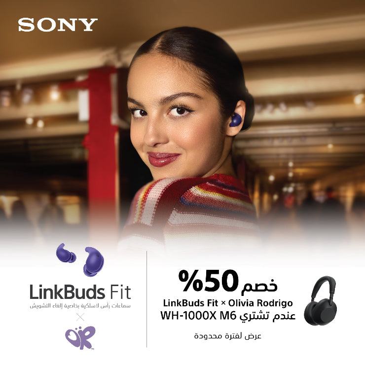Woman wearing Sony LinkBuds Fit with a blurred indoor background